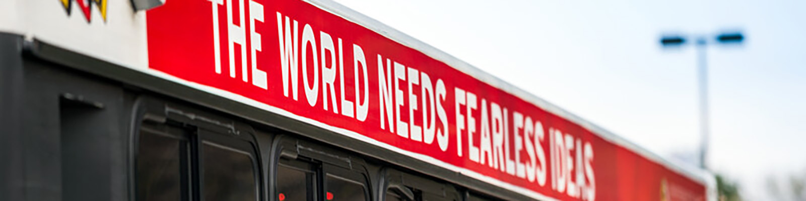 UMD Shuttle with the phrase 'the world needs fearless ideas'